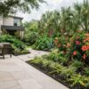 How to Create a Tropical Backyard in Houston with Hibiscus and Low-Maintenance Hardscaping